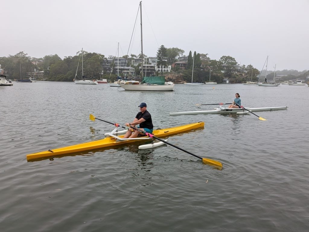 Two rowers enjoying the water in single sculls - great work Jason and Josephine!